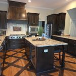 Modern Kitchen With Stone Countertops and Updated Appliances